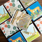 Set of decorative coasters with animal designs on a wooden surface