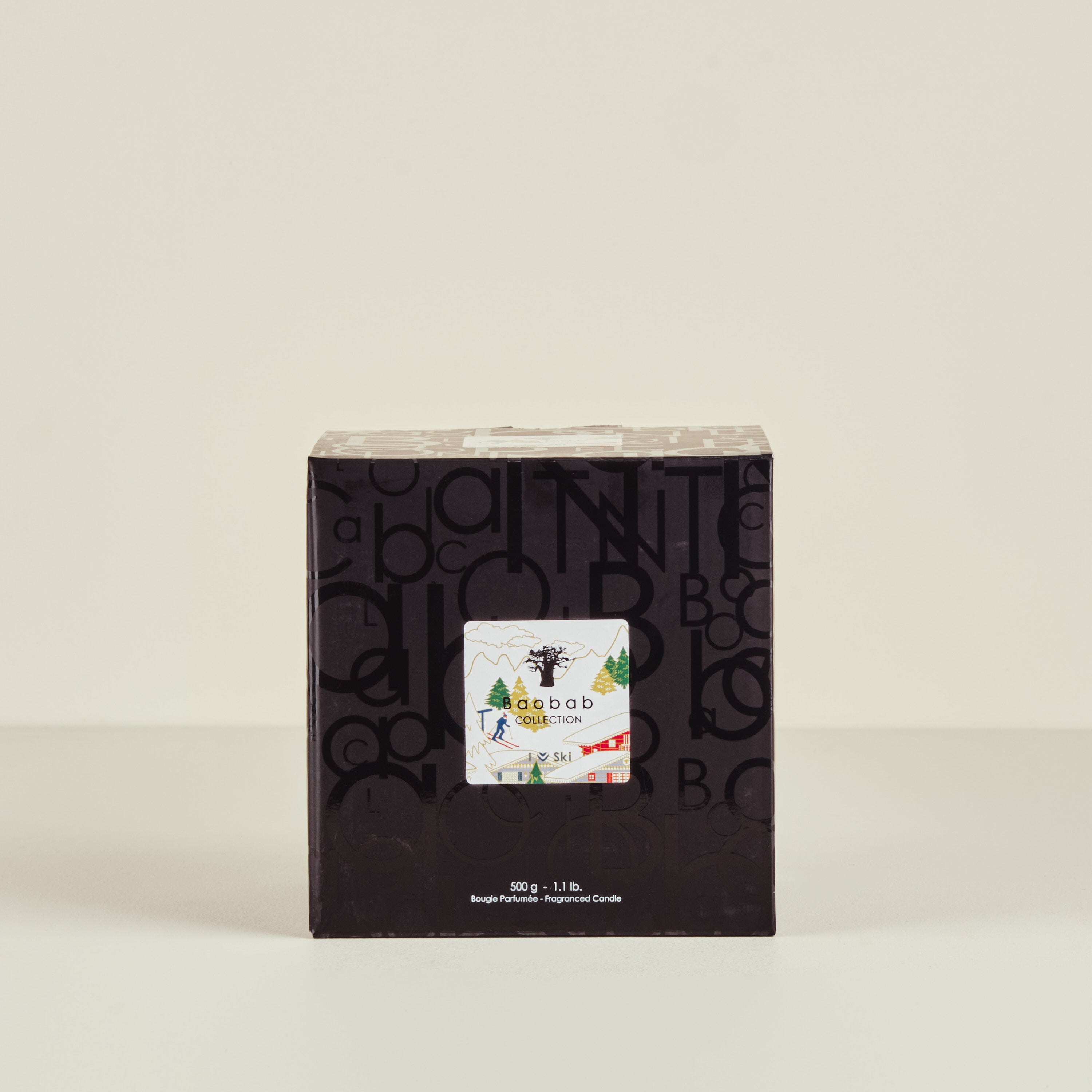 Black box with a smaller white card inside on a beige background