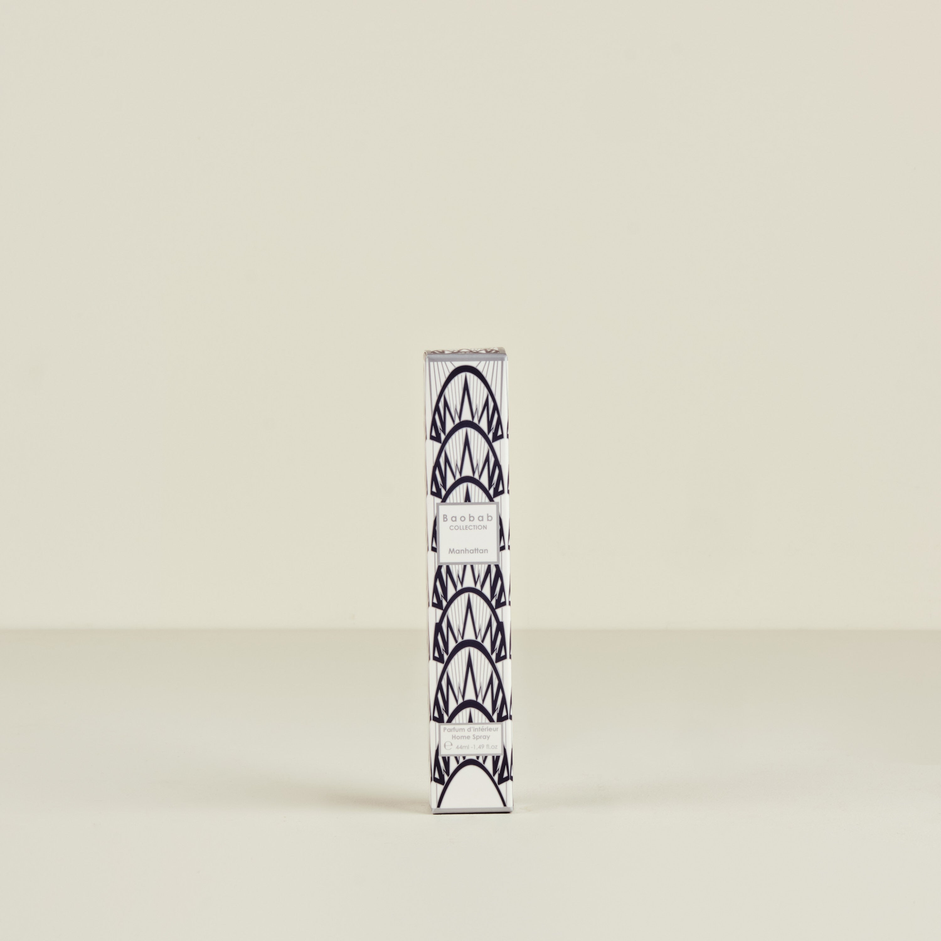 Candle holder with geometric design on a beige background