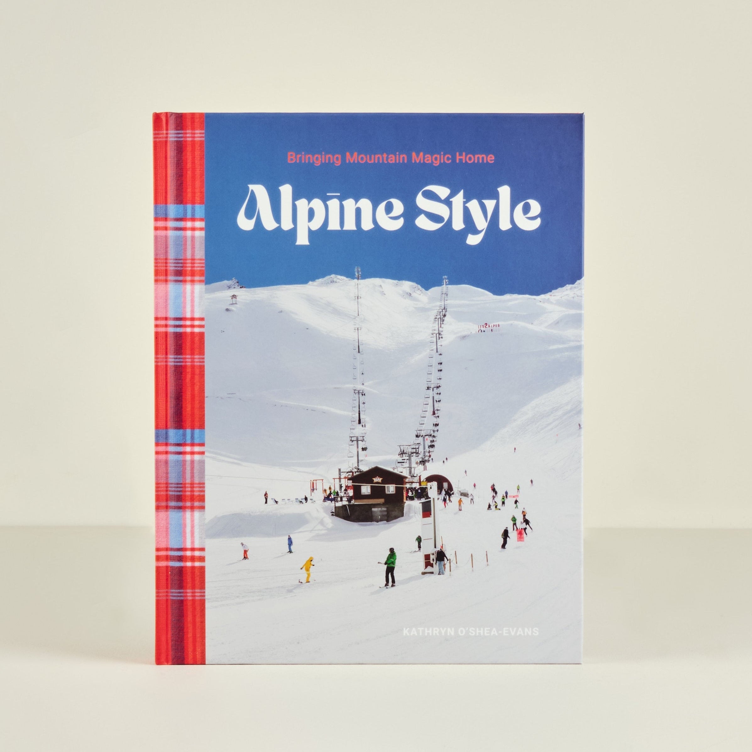 Book titled 'Alpine Style' with a snowy mountain and plaid design on the cover.