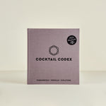 Cocktail Codex book with a logo on a beige background