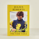 Book titled 'The Farm Table' by Julius Roberts on a beige background