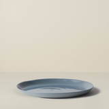 Blue ceramic plate on a beige background