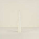 white candle object on a beige background