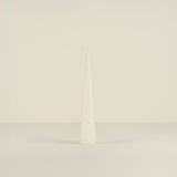 white candle object on a beige background