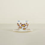 Teacup with floral design on a beige background