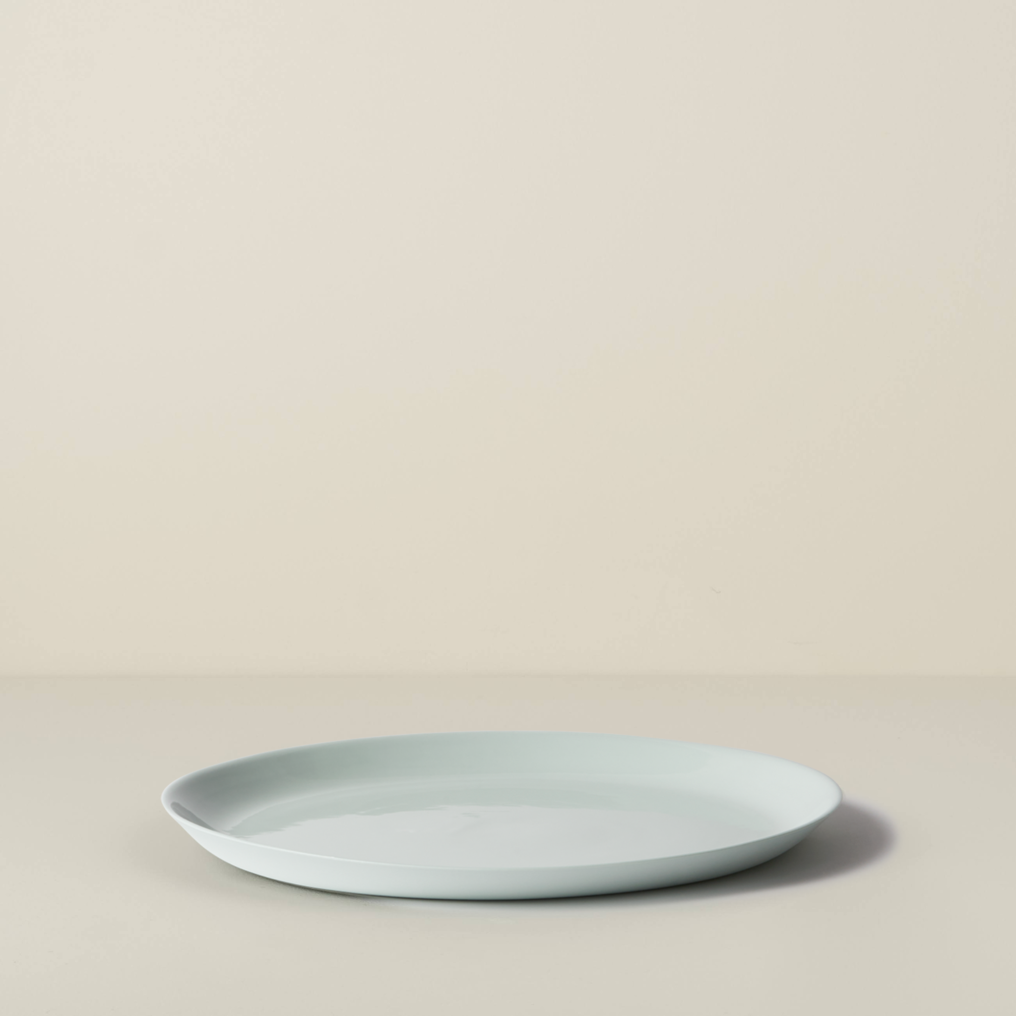 Light blue ceramic plate on a beige background