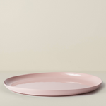 Pink ceramic plate on a light beige background