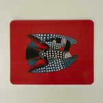 blue black spotted loon on red background