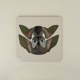 Square placemat with two bird design on a beige background