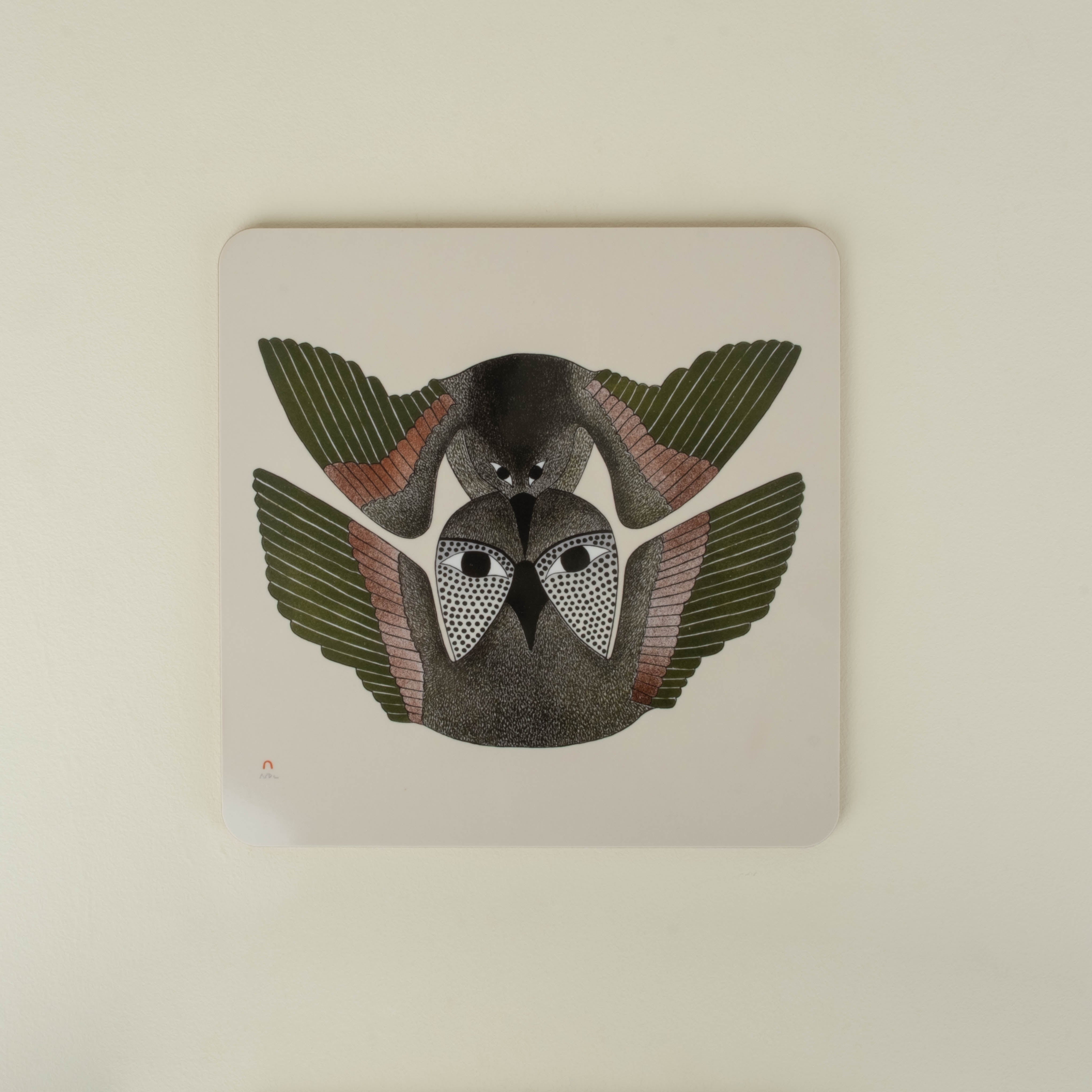 Square placemat with two bird design on a beige background