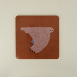 square placemat with owl on orange red background