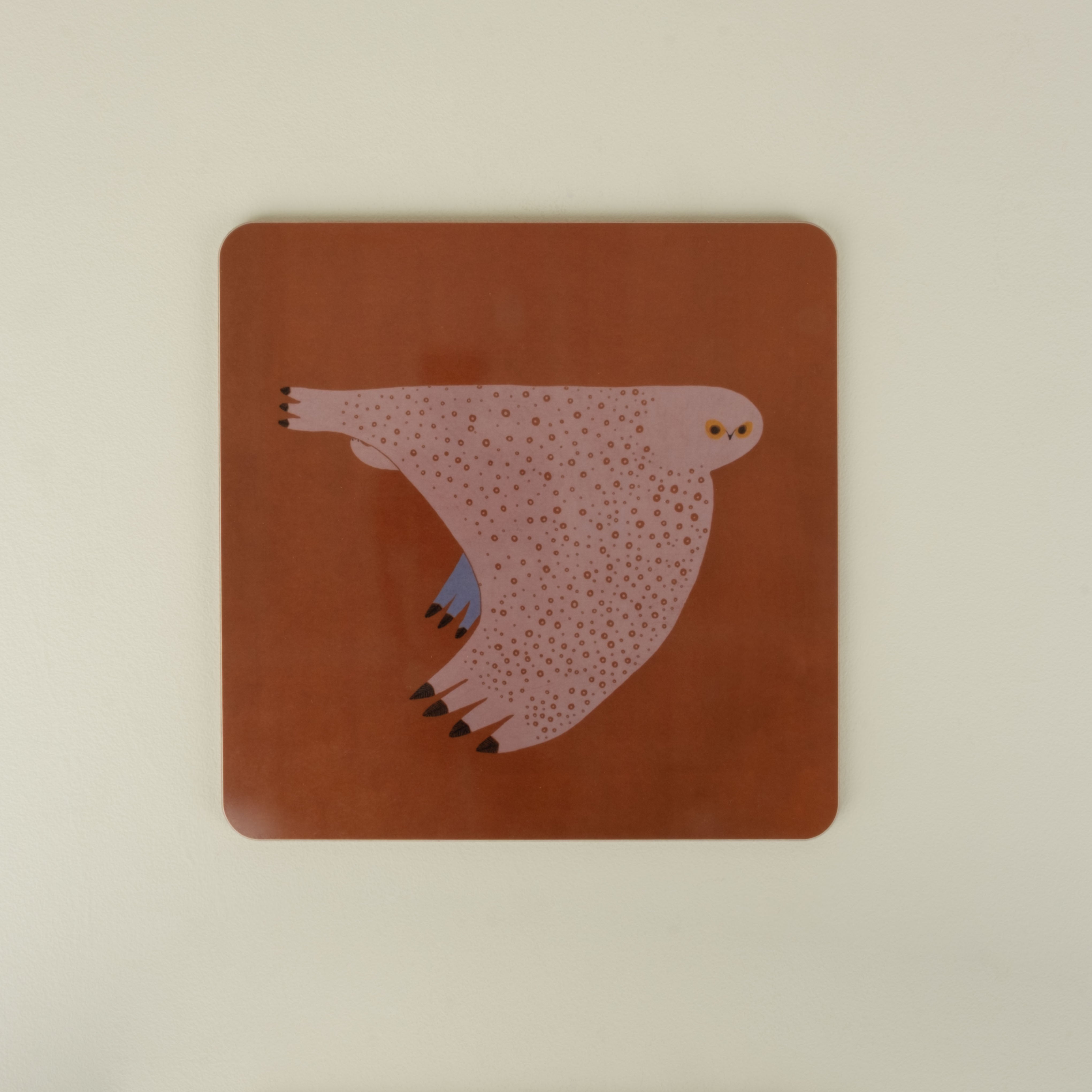 square placemat with owl on orange red background