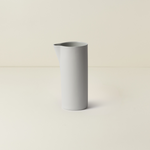 Gray ceramic vase on a beige background