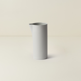 Gray ceramic vase on a beige background