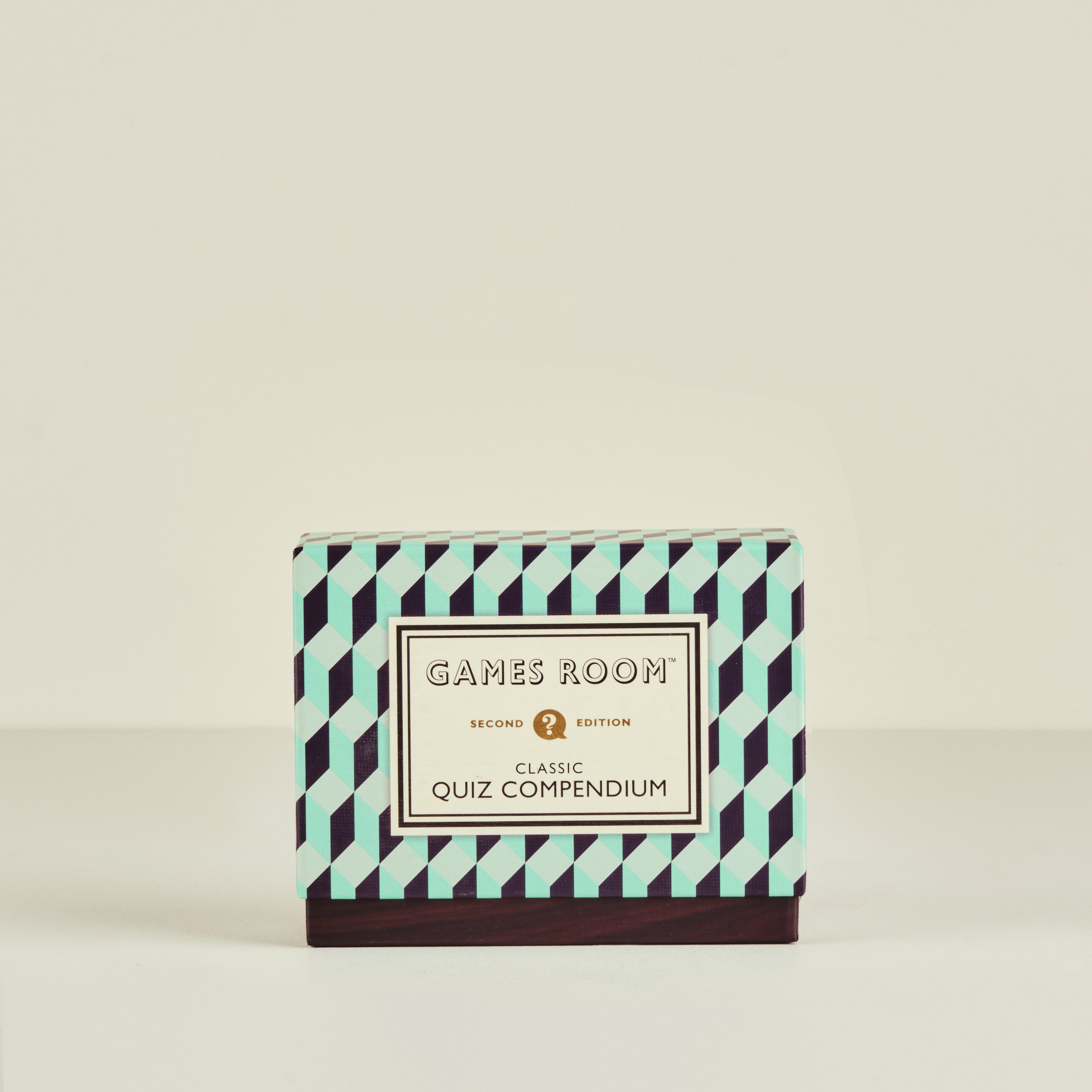 Box labeled 'Games Room Classic Quiz Compendium' with geometric pattern on a beige background