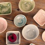 Collection of ceramic bowls on a wooden surface