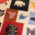 Collection of colorful animal illustrations on placemats.