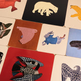 Collection of colorful animal illustrations on placemats.