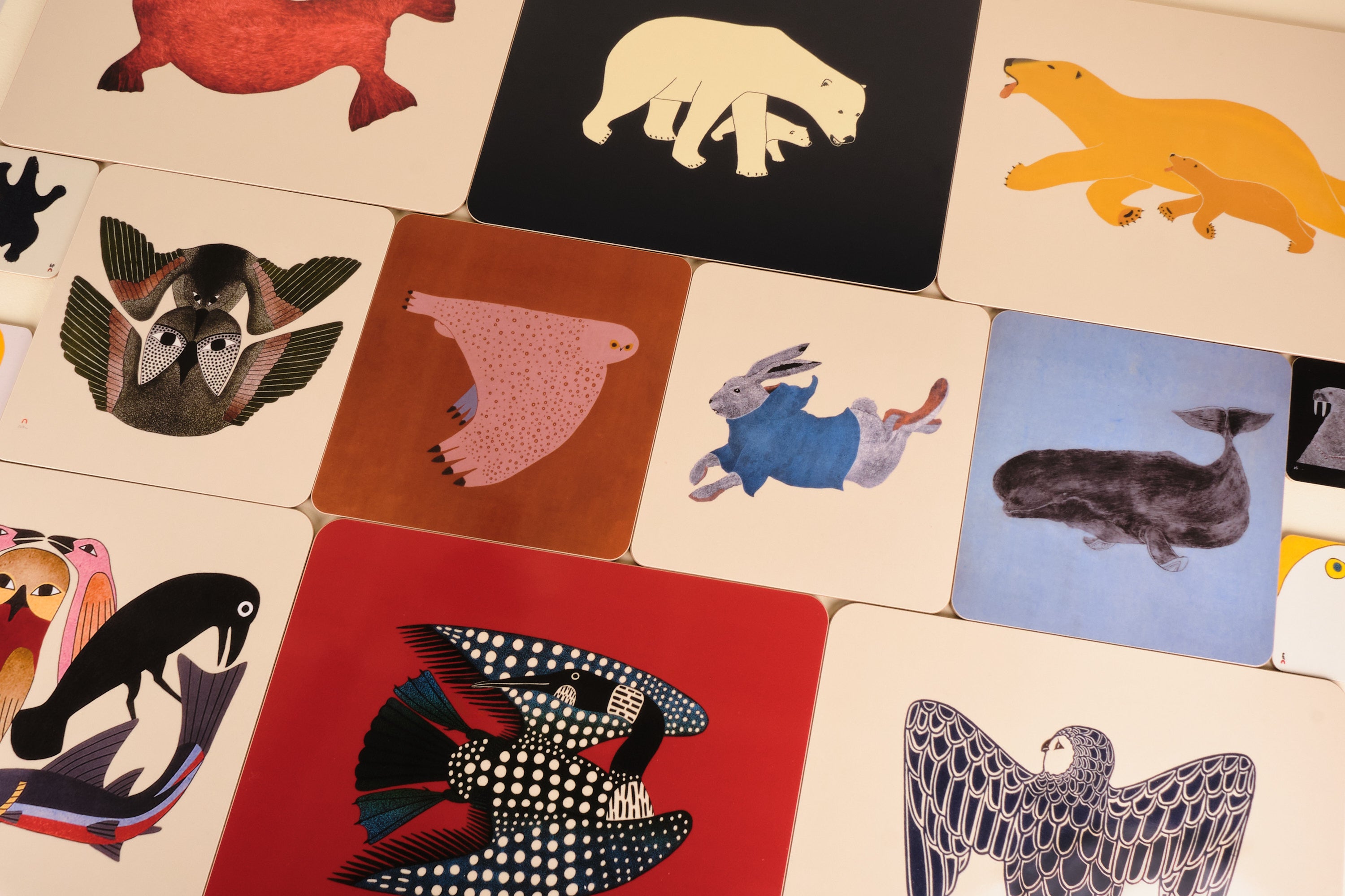 Collection of colorful animal illustrations on placemats.