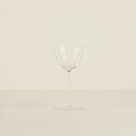 Clear glass vase on a beige background