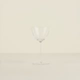 Clear glass vase on a beige background