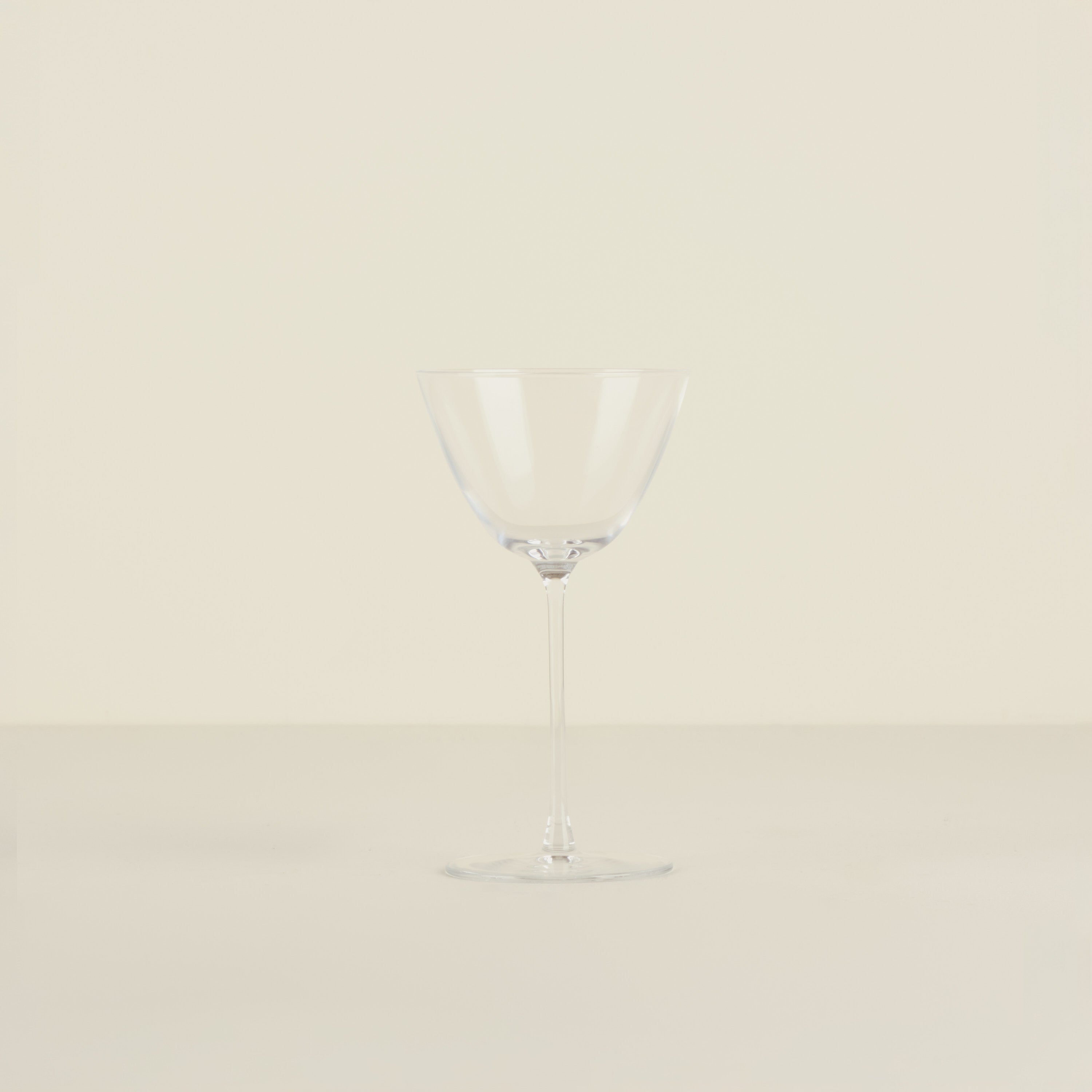 Clear glass vase on a beige background