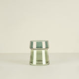 Clear glass vase on a beige background