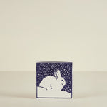 Card with a rabbit design on a beige background