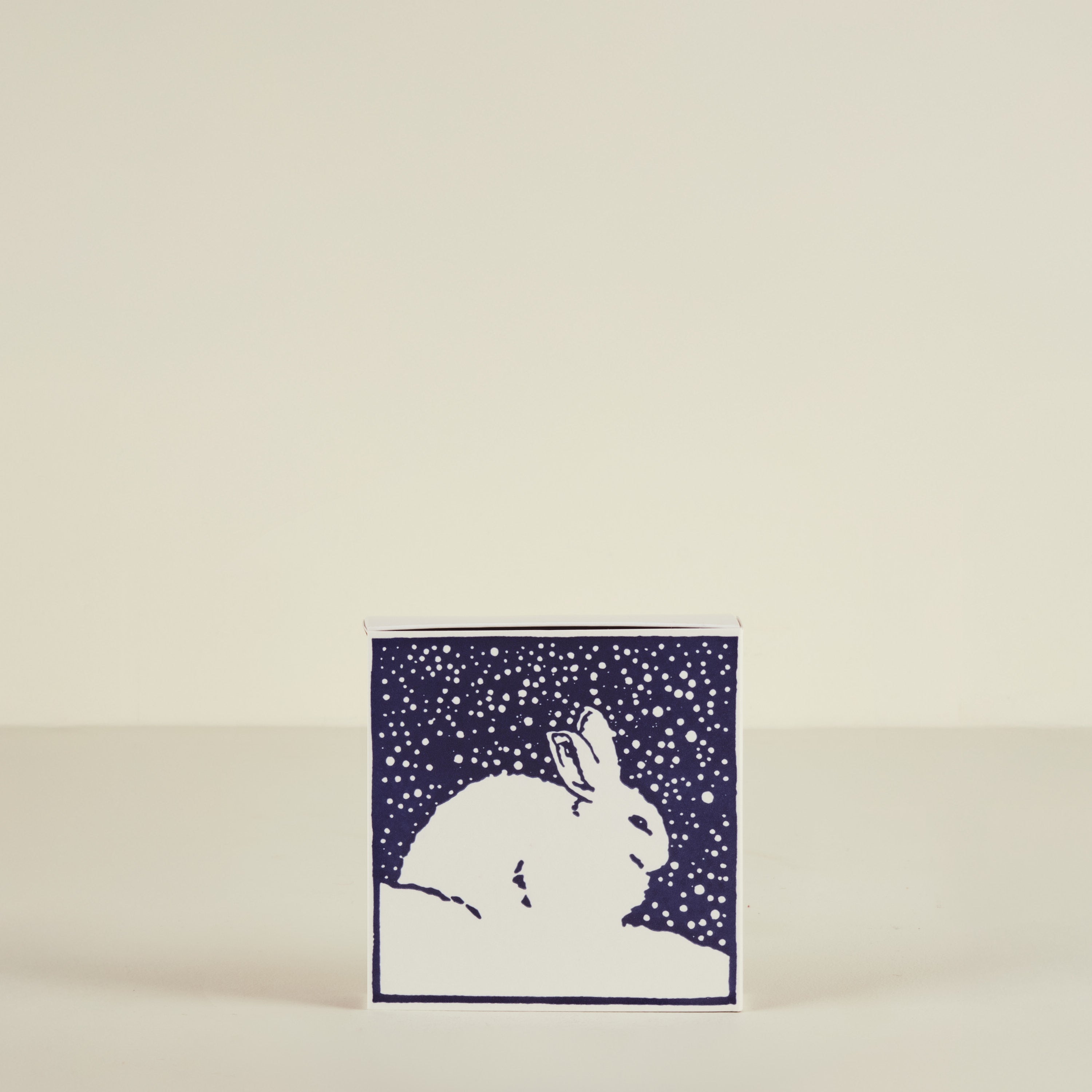 Card with a rabbit design on a beige background