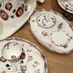 Decorative ceramic plates with floral patterns on a wooden surface