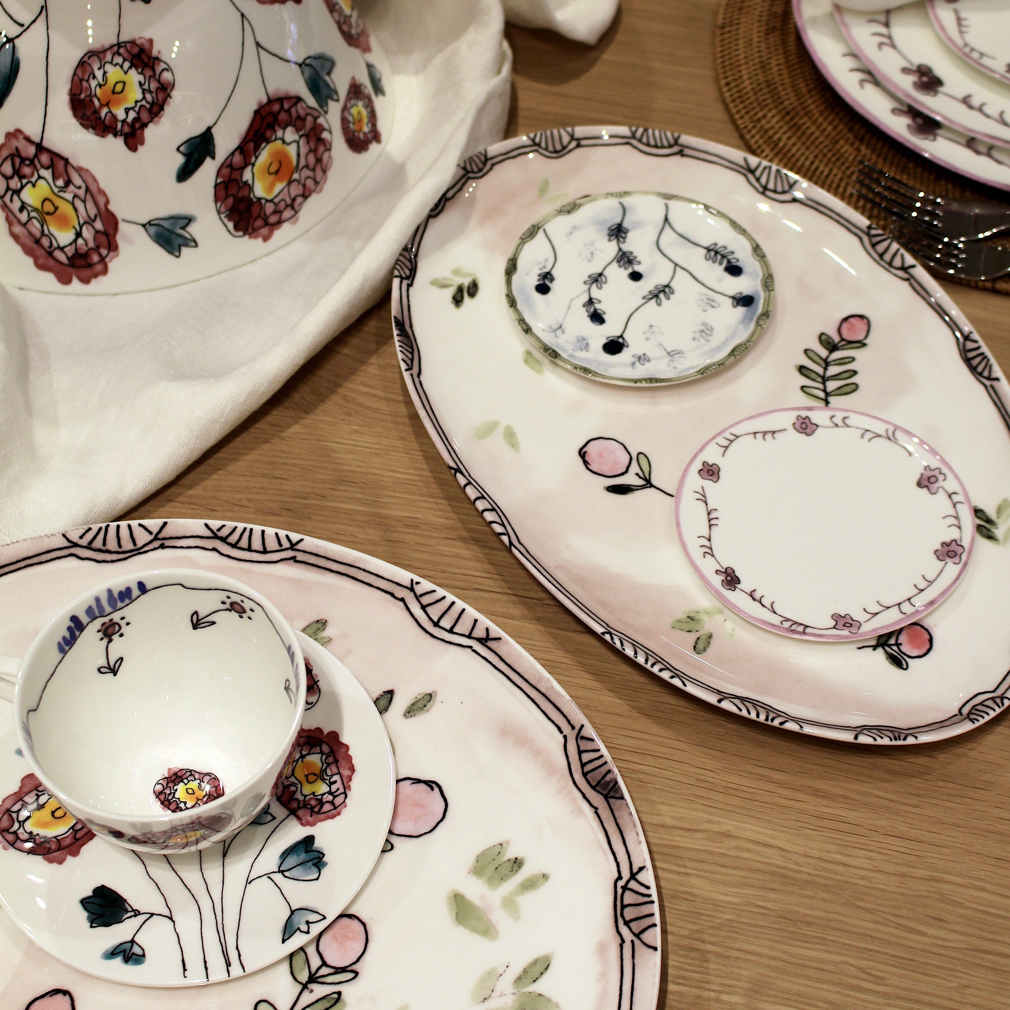 Decorative ceramic plates with floral patterns on a wooden surface