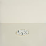 Decorative plate with floral design on a beige background