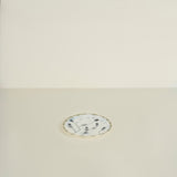 Decorative plate with floral design on a beige background