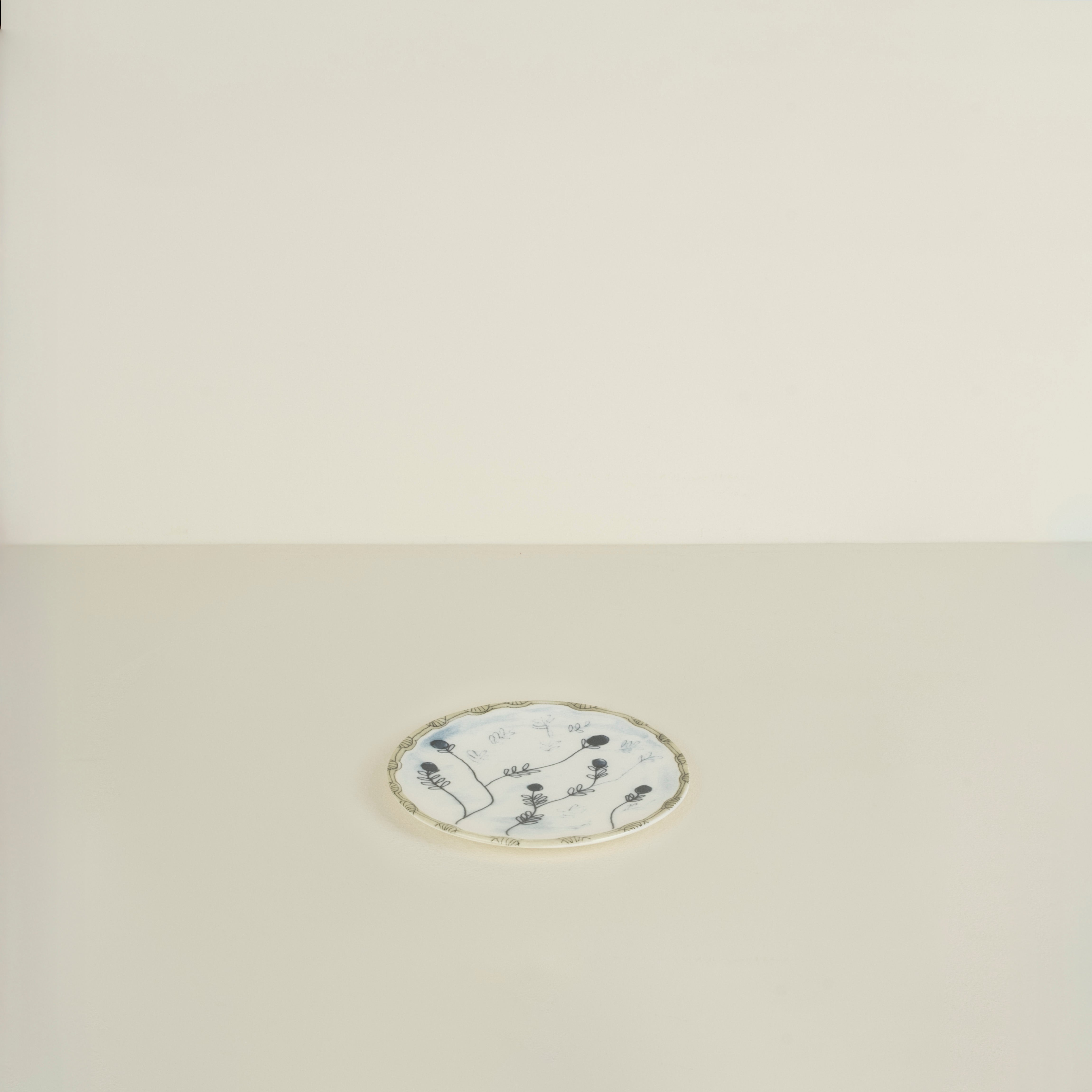 Decorative plate with floral design on a beige background