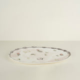 Decorative plate with floral patterns on a beige background