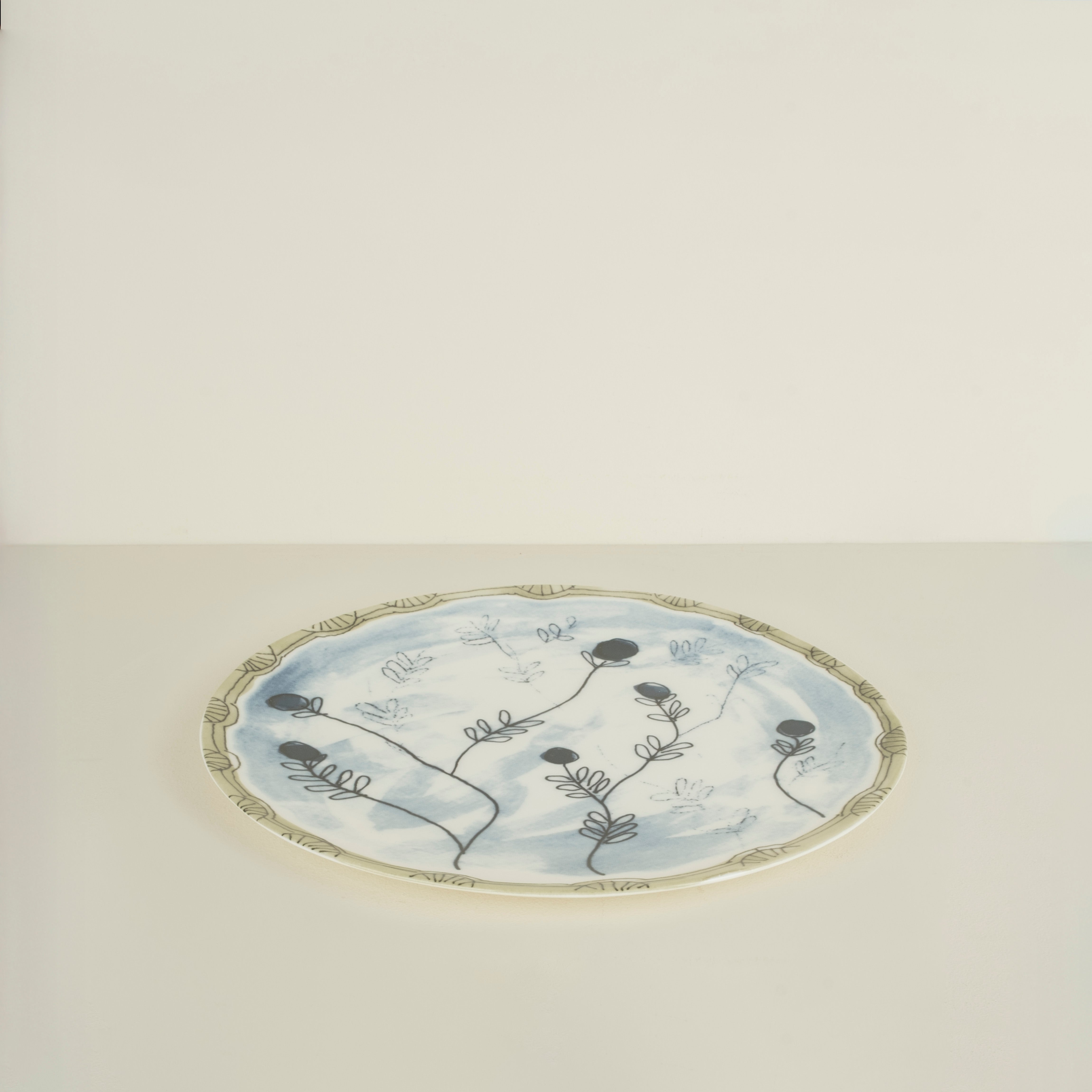 Decorative plate with floral design on a light background
