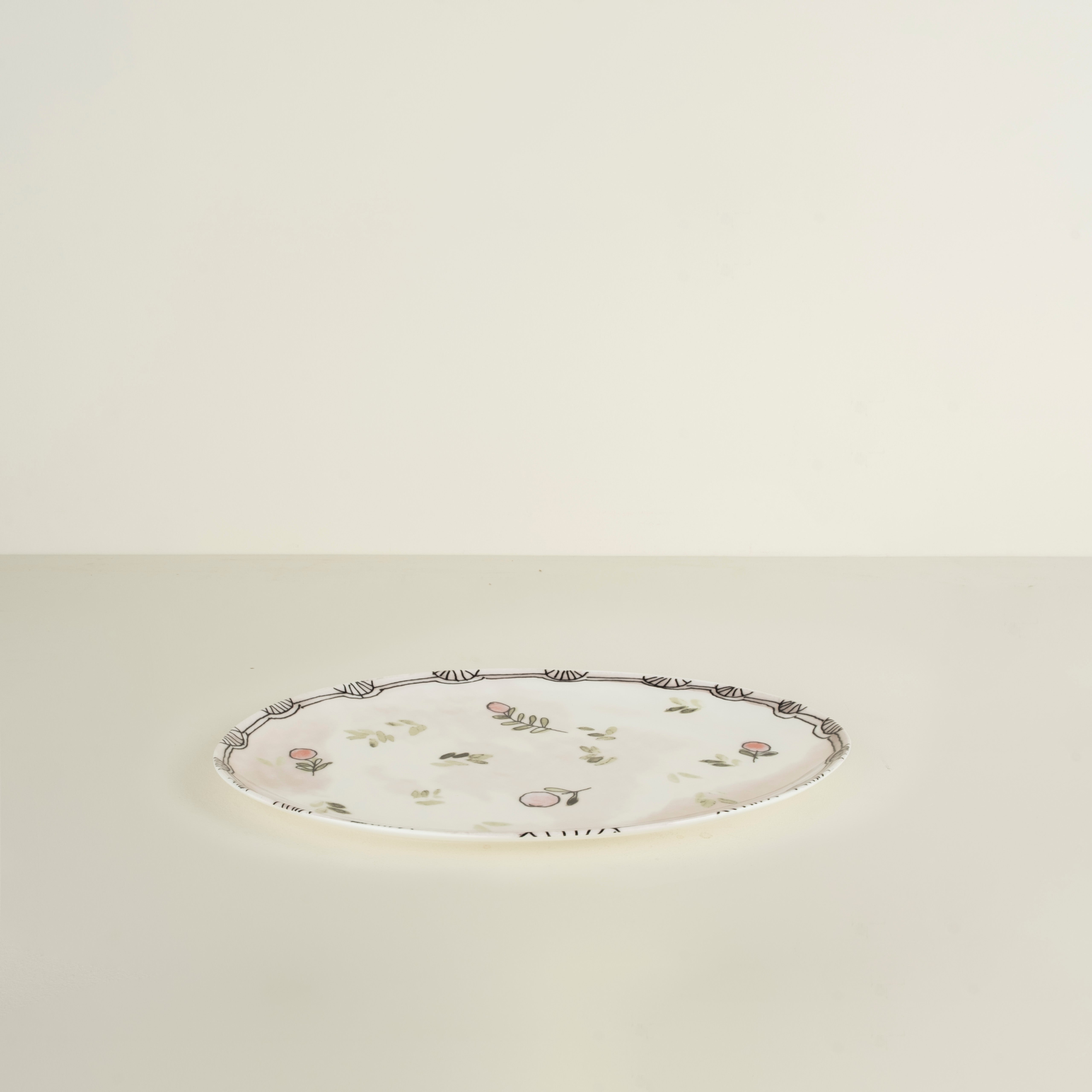 Decorative plate with floral patterns on a beige background