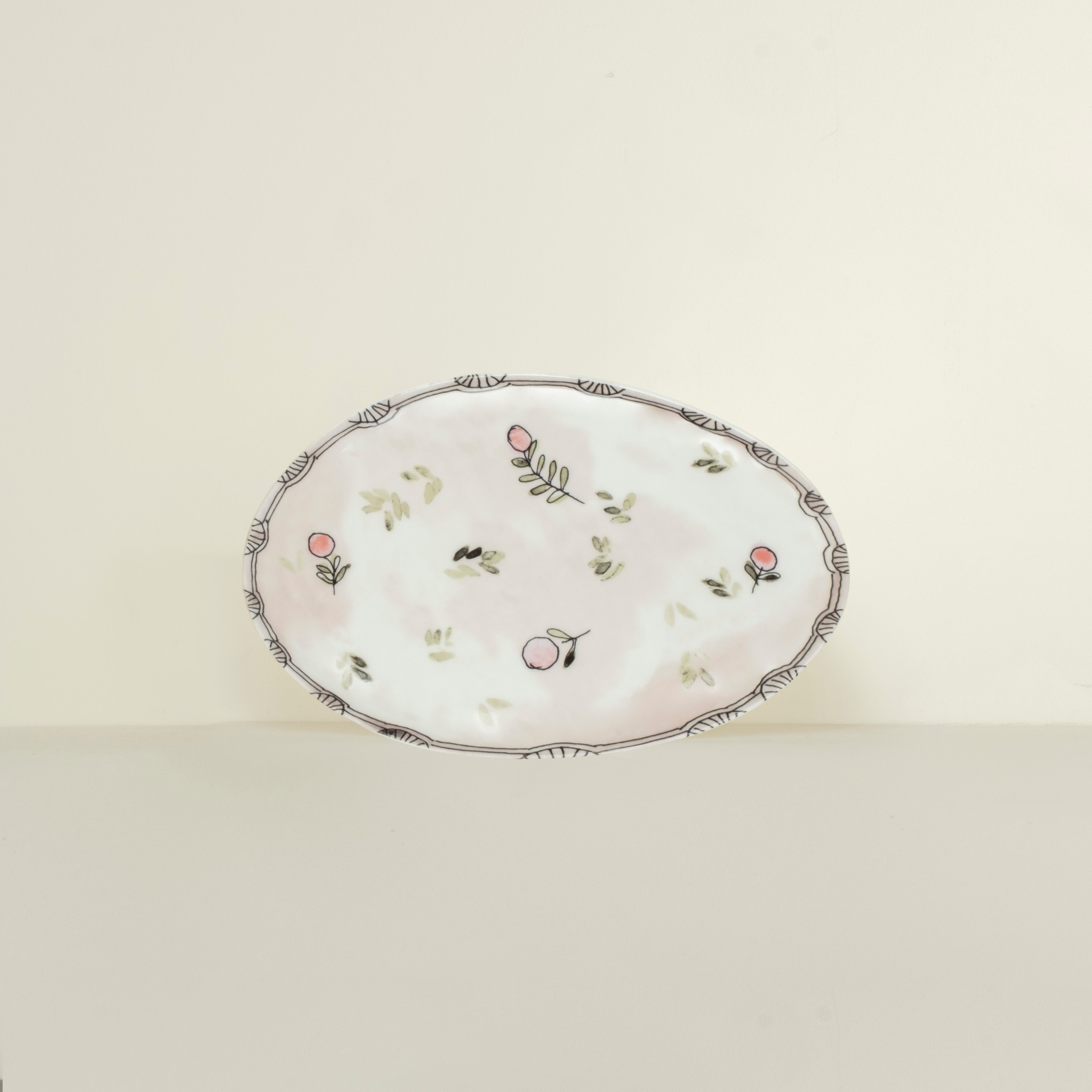 Decorative plate with floral patterns on a light beige background
