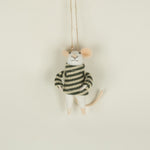 Small plush toy mouse in a striped sweater hanging on a string against a beige background