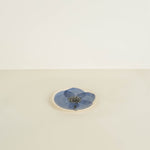 Blue flower coaster on a beige background