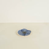 Blue flower coaster on a beige background