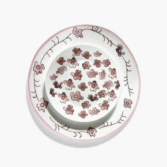 Decorative ceramic plate with floral pattern on a white background
