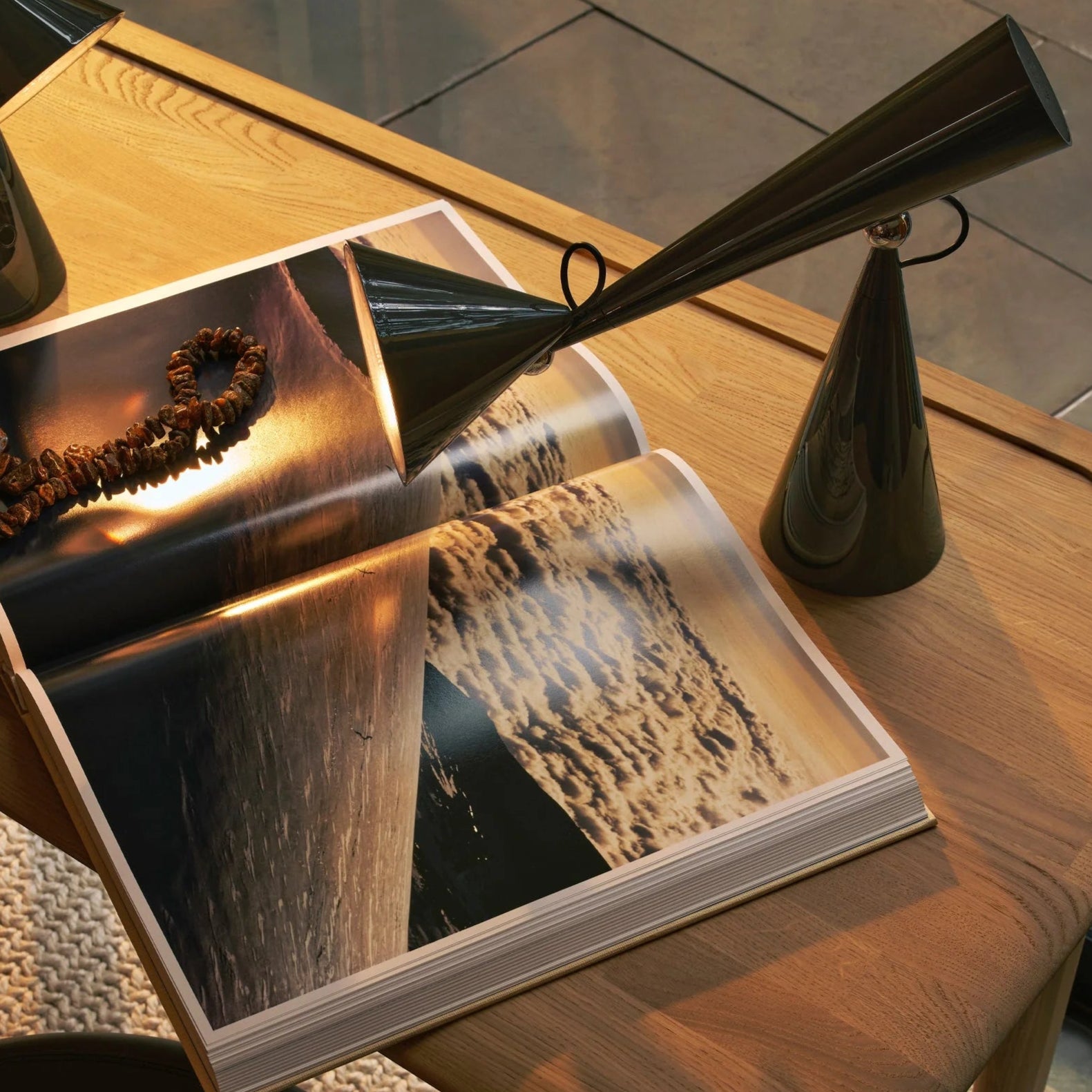 Open book on a wooden table with decorative items