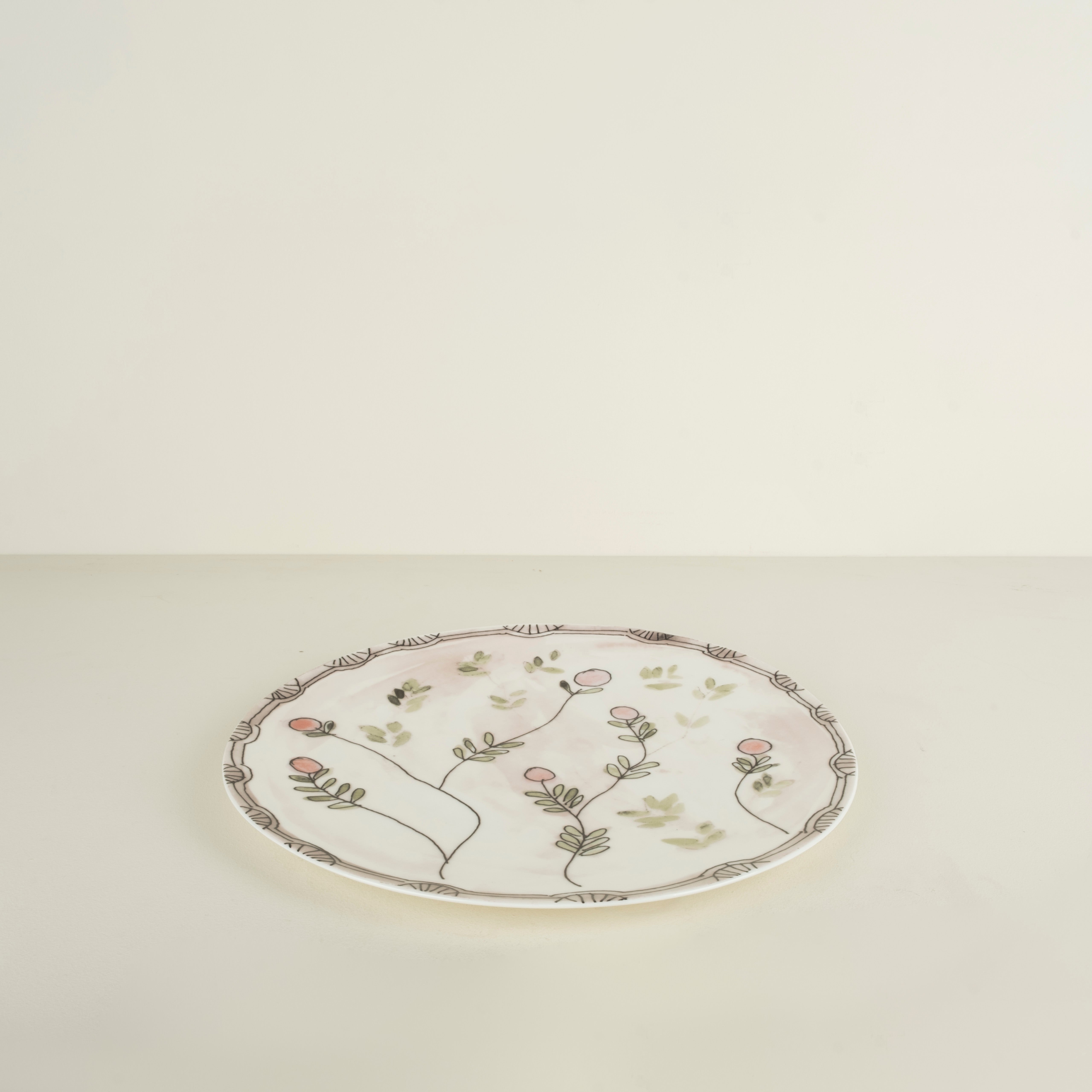 Decorative plate with floral design on a beige background