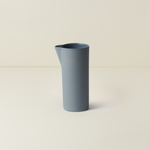 Blue vase on a beige background