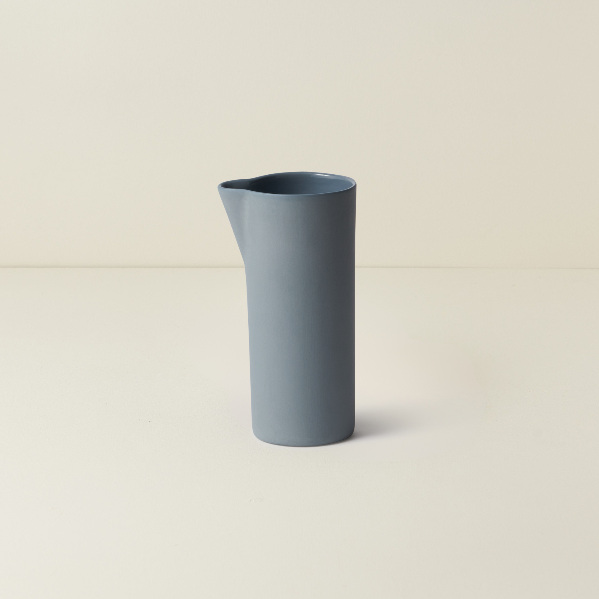 Blue vase on a beige background