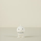 White  character on a beige background