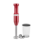 Red hand blender with a clear container on a white background