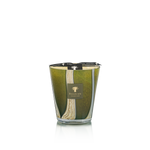 Green candle with a visible brand logo on a white background